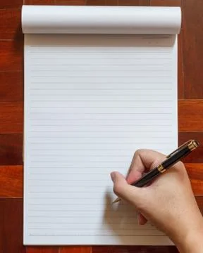 Hand write on notebook with pen. Stock Photos