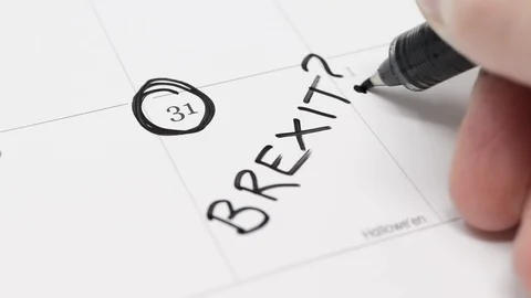 A hand writes BREXIT? on the 31st day of October on a calendar. Stock Footage 117628055