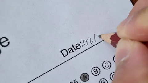 Hand writes date on lined paper with pencil Stock Footage 330760039