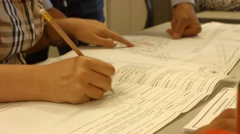 Hand writes into document, adjustments to the document Stock Footage 52549101