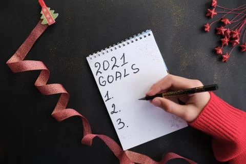 The hand writes in a notebook. Stock Photos