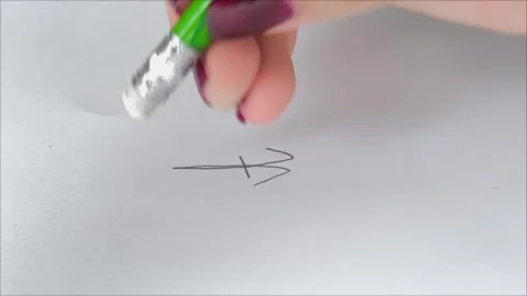 A hand writes with a pencil and erases the drawing with an eraser. 動画素材 311993523