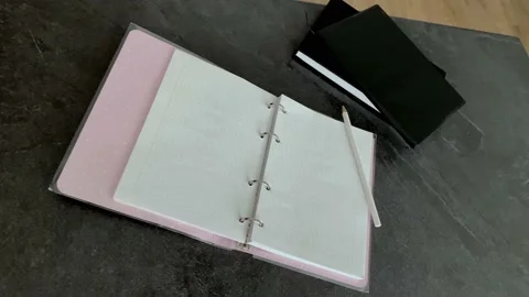 Hand writes with a pencil in a notebook Stock Footage 160145551