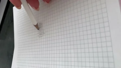 Hand writes with a pencil in a notebook Stock Footage 160145579