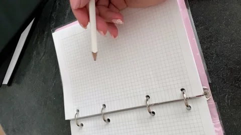 Hand writes with a pencil in a notebook Stock Footage 160145627