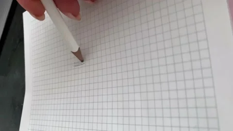 Hand writes with a pencil in a notebook Stock Footage 160749266