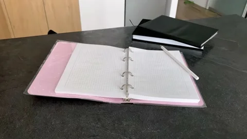 Hand writes with a pencil in a notebook Stock Footage 160749297