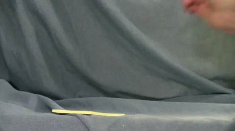 Hand writes on post it note with number 2 pencil against a background Video stock 35533348