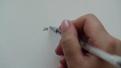 Hand writes sentences on paper creating letter for friend Stock Footage 115154208