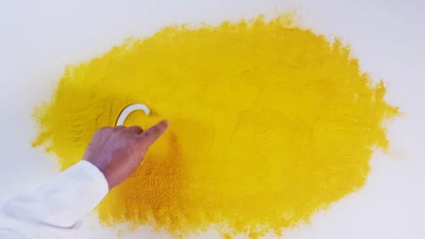 Hand Writes On Turmeric Gold Stock Footage 248770962