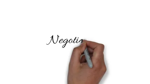 Hand writes on a white background the word negotiations Stock Footage 150424687