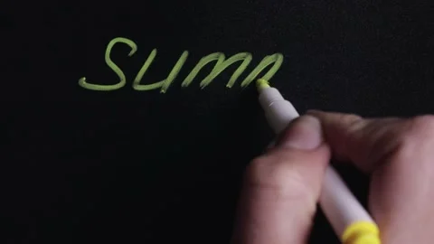 Hand writes the word summer and draws the sun symbol on the board 스톡 동영상 145110506