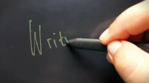 Hand writes the word Writing Stock Footage 284444501
