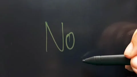 Hand writes the word yes or no Stock Footage 284444462