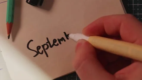Hand writing 1 September date with pen on white paper Stock Footage 340139190