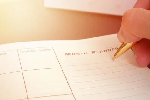 Hand writing blank planning notebook on desk use us organizer schedule life or Stock Photos
