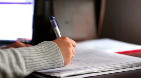 Hand writing, checking and signing documents or student studying 動画素材 56909139