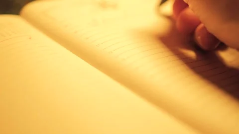 Hand writing close-up. Human hand writing notes on pages of diary. Planning Stock-Footage 306215655