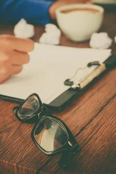 Hand writing with cup of coffee Stock Photos
