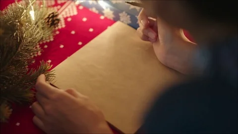 Hand-writing of Dear Santa on the parchment letter paper on Christmas Eve Stock Footage 74107500