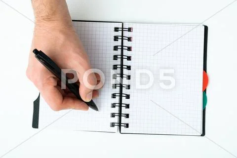 Hand writing on empty notepad Stock Photos
