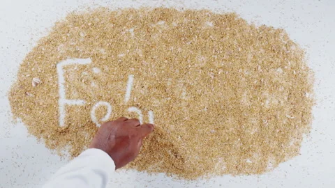 A Hand Writing February in the sand Stock Footage 248666491