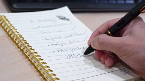Hand Writing Future AI Strategy Goals On Notebook Stock Footage 340846940