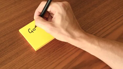 Hand Writing 'Good Luck' on Sticky Note Stock Footage 328331194