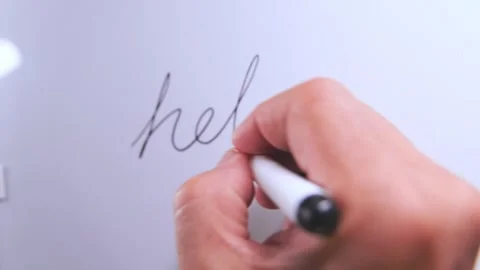 Hand writing hello on a whiteboard Stock Footage 325990769