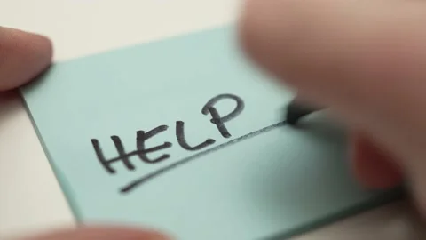 Hand Writing HELP Message on a Paper Sticky Note Closeup Stock-Footage 170832287