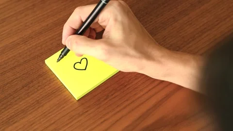 Hand Writing 'I love U' on Sticky Note Stock Footage 328331221