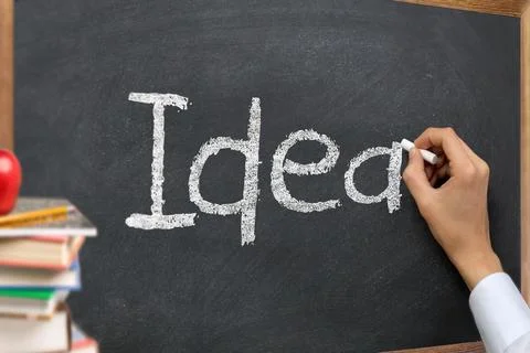 Hand writing idea on a blackboard Foto stock