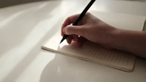 Hand writing journaling. Beautiful light slow motion video. Gratitude journal. Stock Footage 320052165