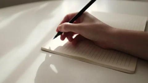 Hand writing journaling. Beautiful light slow motion video. Gratitude journal. Stock Footage 320052209