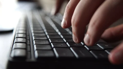 Hand writing on keyboard close up Stock-Footage 128920003