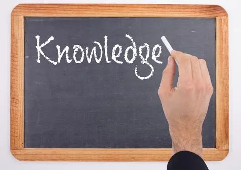 Hand writing Knowledge text on blackboard 스톡 사진