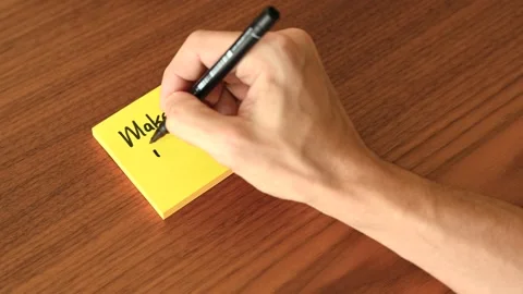 Hand Writing 'Make it Happen' on Sticky Note Stock Footage 328331300