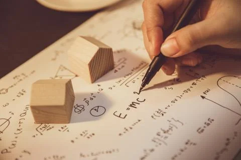 Hand writing math equation classic formula vintage tone. Stock Photos