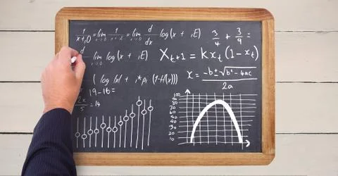 Hand writing math equations on blackboard Foto stock