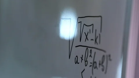 Hand writing a math formula on the board Stock Footage 102615700