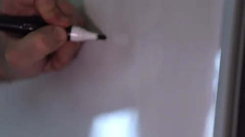 Hand writing a math formula on the board Stock Footage 102616598