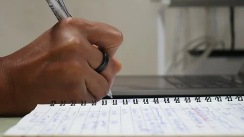Hand writing on notebook. Stock Footage 243473164
