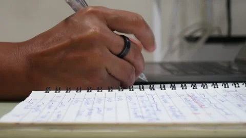 Hand writing on notebook. Stock Footage 243473168