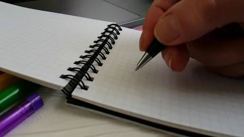 Hand writing in a notepad slow motion Stock Footage 90063545