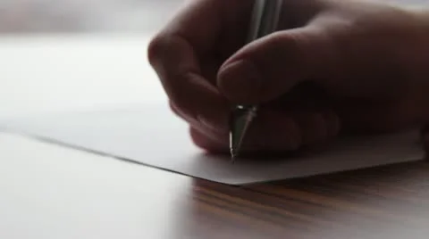 Hand writing on paper with a pen Stock Footage