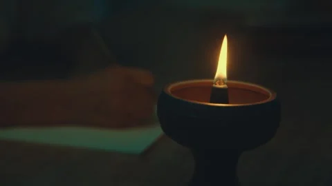 Hand Writing on Paper While Incense Burns in Ceramic Holder 動画素材 337424598