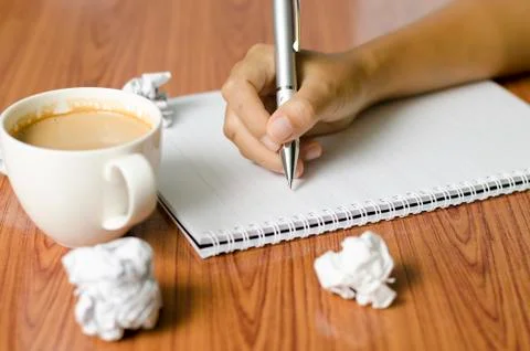 Hand writing with pen on notebook Stock Photos