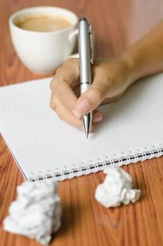 Hand writing with pen on notebook Stock Photos