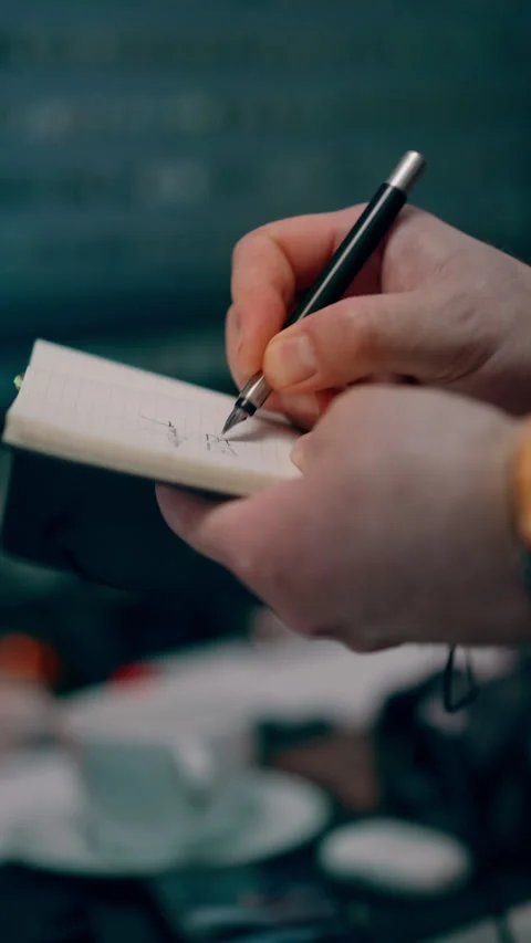 Hand Writing with Pen in Planner Notebook at Office Desk, Close Up Stock Footage 336743771