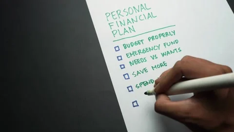 A hand writing personal financial plan list on blank paper Stock Footage 291683741